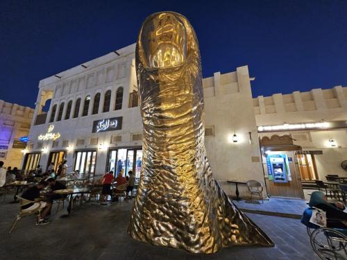 the golden thumb statue, souq waqif, doha, qatar, onlyprathamesh